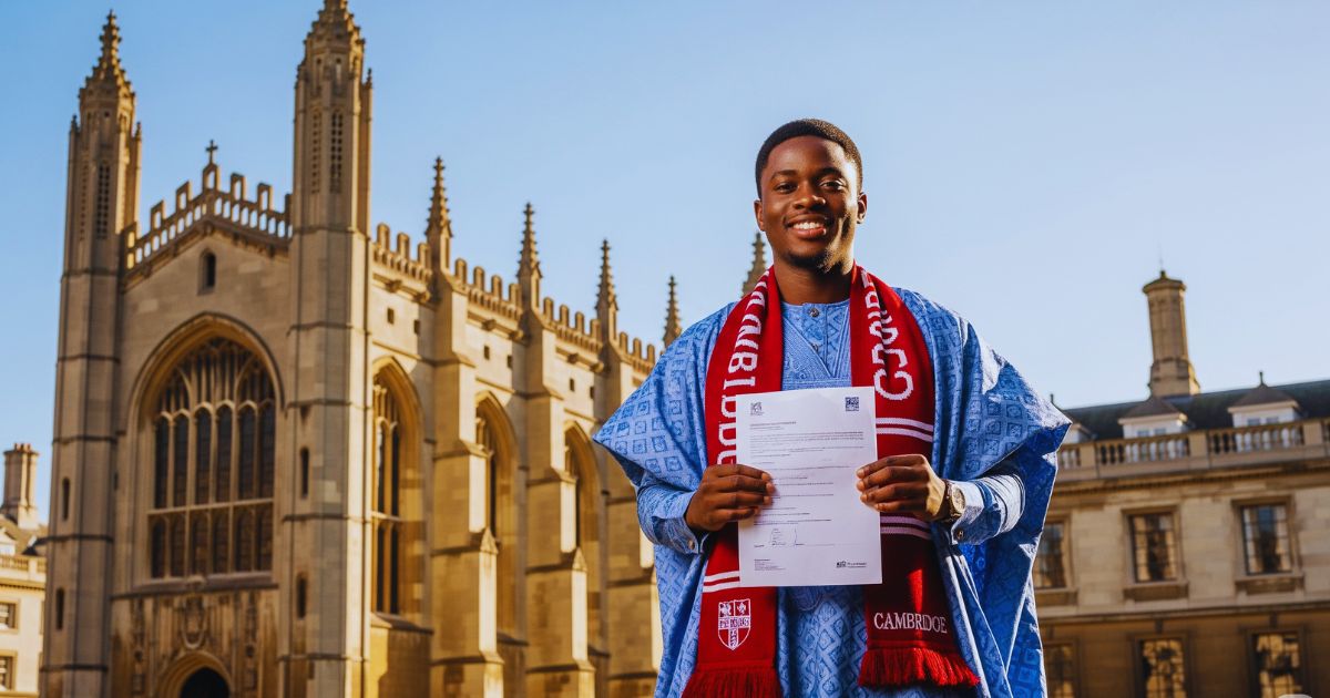 Nigerian student celebrating Cambridge Scholarship acceptance in front of King's College Chapel